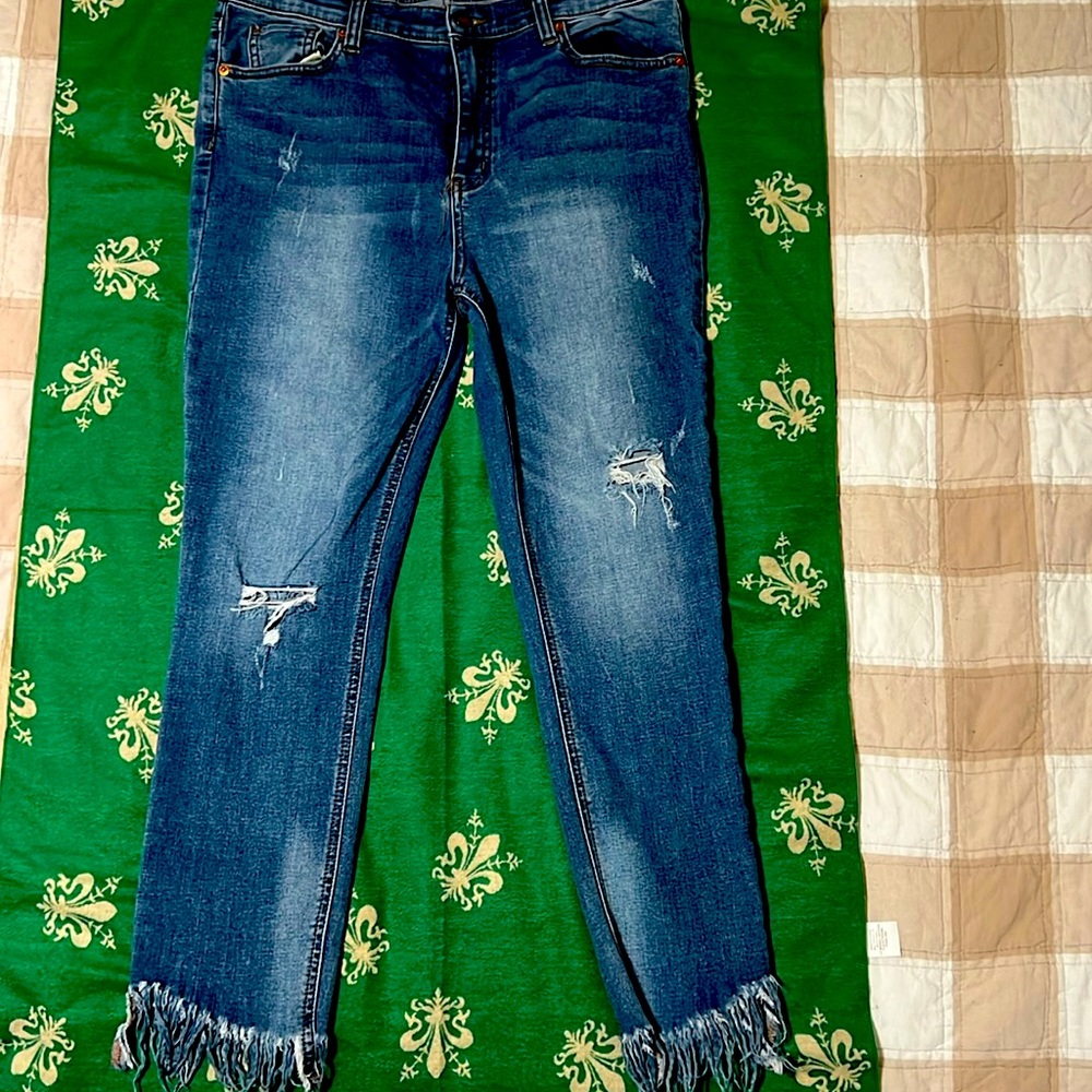 Free People fringed bottom ankle length jeans.